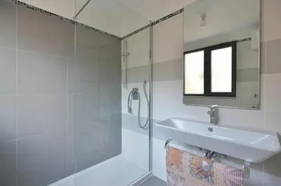 a bathroom with a glass shower and a sink at Colosseum Colosseo in Rome