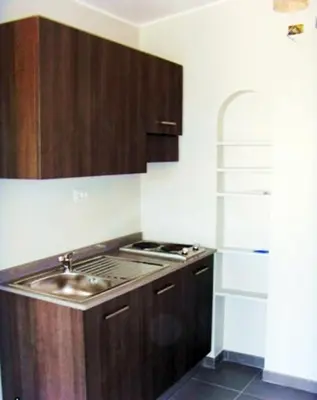 a kitchen with a sink and a stove at Colosseum Colosseo in Rome
