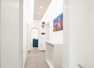 a hallway with white walls and a white counter top at Élite Vatican Refuge in Rome