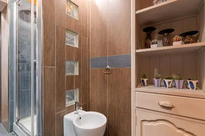 a bathroom with a toilet and a sink and a shower at Rome as you feel - Casa Governo Vecchio in Rome