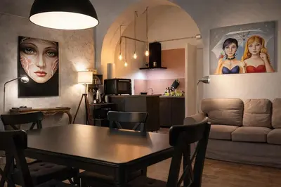 a living room with a table and a couch at Afnakafna Home in Rome