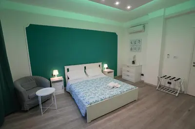 a bedroom with a bed with a stuffed animal on it at House Appio Latino Roma in Rome
