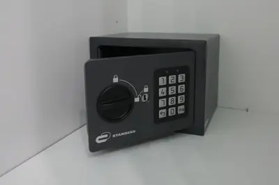 a black microwave oven sitting on top of a counter at House Appio Latino Roma in Rome