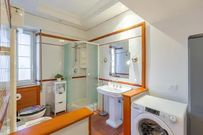 a bathroom with a washing machine and a sink at Milvio Bridge - Olympic Stadium, Farnesina, A-C in Rome