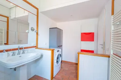 a bathroom with a sink and a washing machine at Milvio Bridge - Olympic Stadium, Farnesina, A-C in Rome