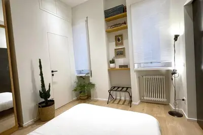 a bedroom with a white bed and a window at STUDIO4 ROMA in Rome