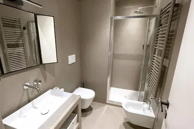 a bathroom with a sink and a toilet and a shower at STUDIO4 ROMA in Rome