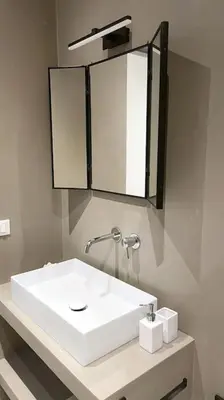 a bathroom with a white sink and a mirror at STUDIO4 ROMA in Rome