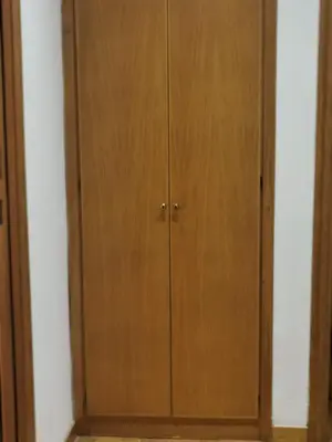 a pair of wooden cabinets in a room at La Casetta di Benedetta in Rome