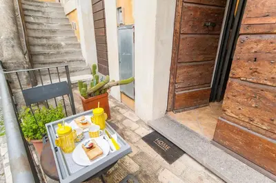 a tray of food on a table in front of a door at L'antico borgo di Trastevere III in Rome