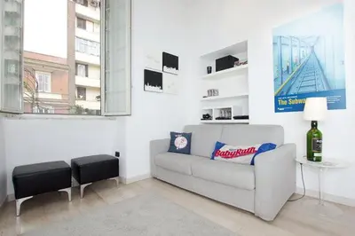 a living room with a couch and a table at HT Loft Testaccio in Rome