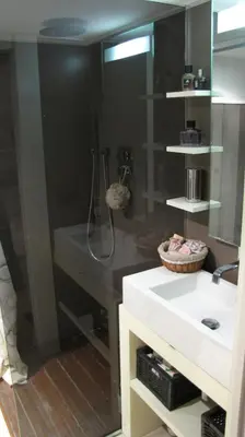 a bathroom with a shower and a white sink at HT Loft Testaccio in Rome