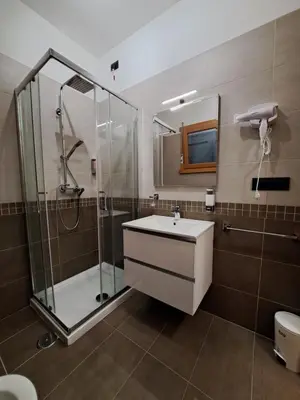 a bathroom with a shower and a sink at Angy's house Roma in Rome