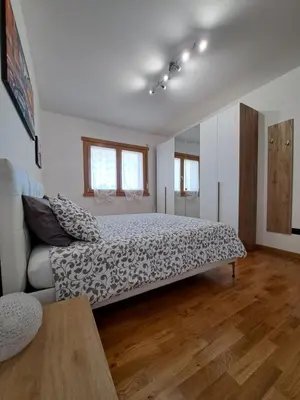 a bedroom with a large bed and a couch at Angy's house Roma in Rome