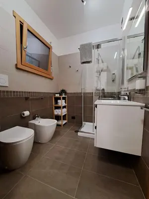 a bathroom with a tub and a toilet and a sink at Angy's house Roma in Rome