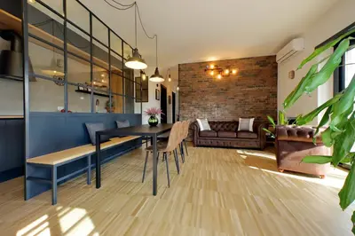 a living room with a table and a couch at YCH-Trilocale stile Industriale in Rome