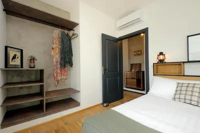 a bedroom with a bed and a black door at YCH-Trilocale stile Industriale in Rome