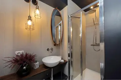 a bathroom with a sink and a shower at YCH-Trilocale stile Industriale in Rome