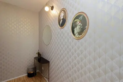 a bathroom with two mirrors on a tiled wall at YCH TRILOCALE FINEMENTE ARREDATO VICINO ALLA METRO in Rome