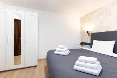 a bedroom with a bed with towels on it at Arya Roma Vaticano in Rome