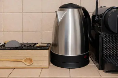 a coffee pot sitting on a counter next to a toaster at Arya Roma Vaticano in Rome