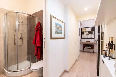 a bathroom with a shower and a toilet at Appartamento Celio in Rome