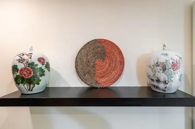 three vases sitting on a shelf in a room at Appartamento Celio in Rome