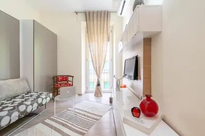 a living room with a couch and a tv at Appartamento Celio in Rome