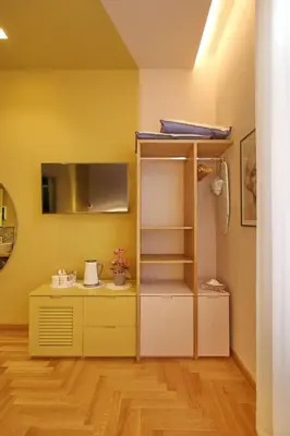 a room with a bunk bed and a desk at Dreaming Rome Suites in Rome