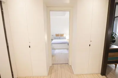 a hallway with a door leading to a bedroom at Vintage and Design in the Heart of Vibrant Pigneto in Rome