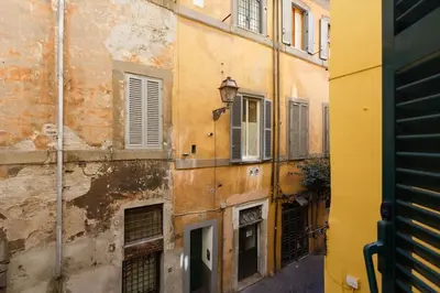 an old building in an alley in an old town at Navona 360 in Rome