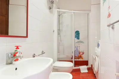 a bathroom with a toilet and a sink and a shower at Navona 360 in Rome