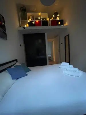 a bedroom with a white bed with two towels on it at La Casa Romana in Rome