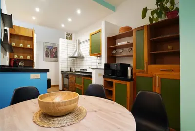 a kitchen with a wooden bowl on a table at La Casa Romana in Rome