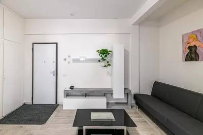 a living room with a couch and a table at AmoRoma Holiday in Rome