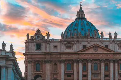 a building with a dome on top of it at Bright Penthouse 2 M stops from Vatican Museums in Rome