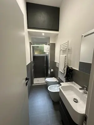 a bathroom with a sink and a toilet and a shower at Apartment Roma Centro San Pietro e Musei Vaticani in Rome