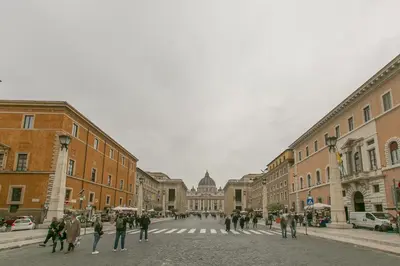 a group of people crossing a street in a city at Borgo Vittorio 20 Vatican Home in Rome