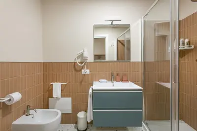 a bathroom with a sink and a mirror at Borgo Vittorio 20 Vatican Home in Rome