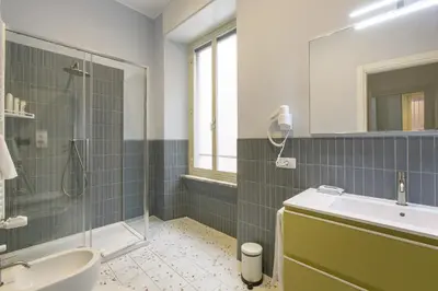 a bathroom with a sink and a shower at Borgo Vittorio 20 Vatican Home in Rome