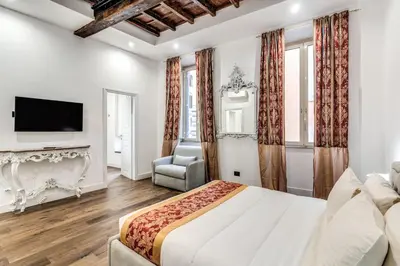 a bedroom with a large bed and a fireplace at RIPETTA234 in Rome