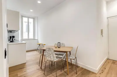 a kitchen and dining room with a table and chairs at RIPETTA234 in Rome