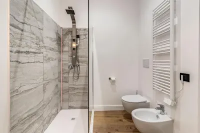 a bathroom with a shower and a toilet and a sink at RIPETTA234 in Rome