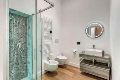 a bathroom with a toilet and a sink and a shower at RIPETTA234 in Rome