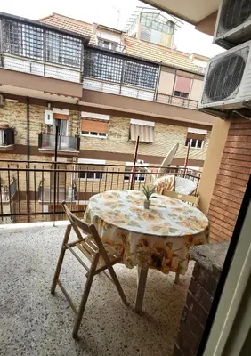 a table and chairs on the balcony of a building at Appartamento di Sara in Rome