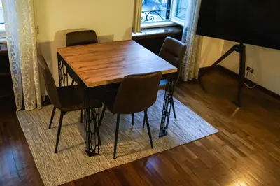 a wooden table and chairs in a room at Appartamento Roma centro in Rome