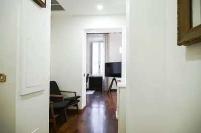 a hallway with a living room and a television at Appartamento Roma centro in Rome