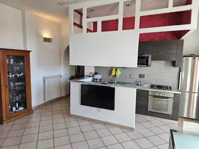 a kitchen with a large white island in a kitchen at ST. PETER'S ROOMS SUITE in Rome