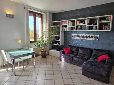 a living room with a couch and a table at ST. PETER'S ROOMS SUITE in Rome