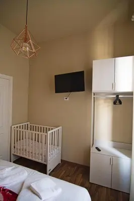 an open white door in a room with a desk at GUEST HOUSE GIL - ROME Colosseum Area in Rome